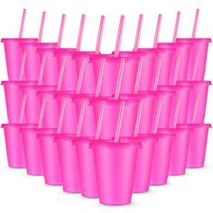 many pink cups with straws in them are lined up against each other on a white background