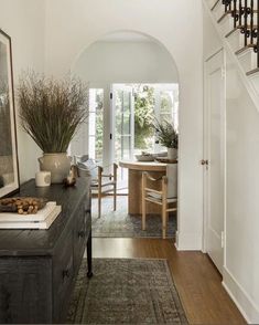 an entry way leading to a dining room and living room