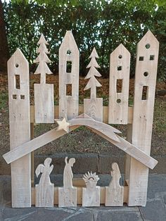 a nativity scene made out of wooden boards