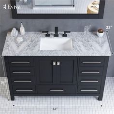 a bathroom sink sitting under a mirror next to a counter top with two mirrors above it