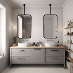 two bathroom sinks with mirrors above them in a white and gray color scheme on the wall