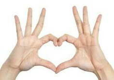 two hands making a heart shape with their fingers