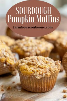 pumpkin muffins on a cutting board with text overlay that reads sourdough pumpkin muffins