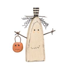 a wooden figure with a pumpkin hanging from it's side and a handbag attached to its back