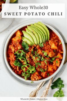 easy whole 30 sweet potato chili with avocado and cilantro in a white bowl