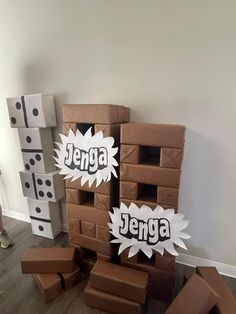 some cardboard boxes are stacked on top of each other in the middle of a room