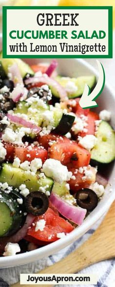 greek cucumber salad with lemon vinaigrete and feta cheese in a white bowl