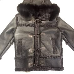 Shearling Fur Coat With Fleece Lining For Cold Weather, Black Sheepskin Fur Coat With Faux Fur Lining, Designer Sheepskin Fur Coat For Winter, Luxury Shearling Fur Coat For Cold Weather, Black Shearling Fur Coat For Cold Weather, Black Sheepskin Outerwear For Cold Weather, Black Sheepskin Fur Coat For Winter, Black Sheepskin Fur Coat For Cold Weather, Luxury Black Sheepskin Fur Coat