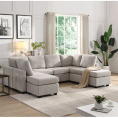 a living room with a sectional couch and coffee table