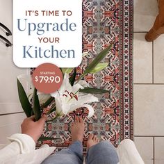 a person standing next to a white flower on top of a kitchen floor with the words it's time to upgrade your kitchen starting $ 999 9990