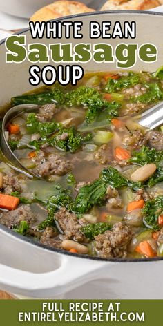 a white bean sausage soup in a pot with carrots and spinach on the side