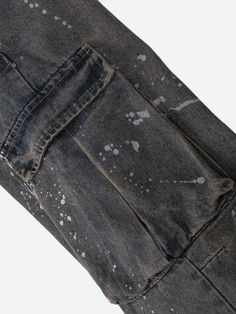 The Stained Cargo Jeans add a grunge-inspired touch with their distressed finish and splattered paint details. Featuring a relaxed, baggy fit, they pair perfectly with crop tops or casual tees for a laid-back streetwear look. Denim material Paint stained design Button & zip fastening Double pockets at front & back Cargo pockets Belt loop detail Low rise Wide leg Cotton, polyester Distressed Washed Black Grunge Bottoms, Distressed Grunge Washed Black Bottoms, Distressed Faded Bottoms For Streetwear, Faded Distressed Streetwear Jeans, Casual Paint Splatter Streetwear Bottoms, Utility Style Distressed Washed Black Bottoms, Streetwear Washed Black Stonewashed Bottoms, Washed Black Distressed Utility Bottoms, Acid Wash Distressed Bottoms For Streetwear