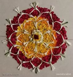 an arrangement of flowers arranged in the shape of a flower