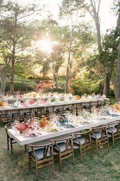 a long table set up for an outdoor dinner