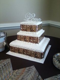 a three tiered cake sitting on top of a table