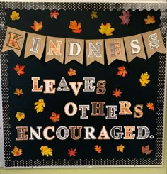 a sign that says kindness leaves others encouraged with fall leaves on it