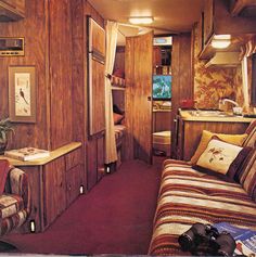 the interior of a train car with wood paneling and red carpeted flooring