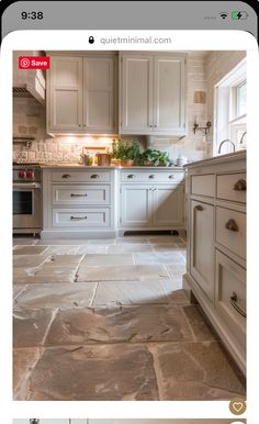 the kitchen is clean and ready to be used by someone who likes it on their phone