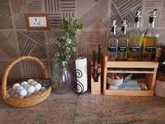 there are many bottles and containers on the counter with soaps, salt and pepper shakers