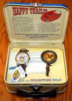 an open suitcase with two watches in it