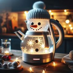 a snowman light up tea kettle sitting on top of a table