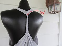 the back of a mannequin's torso with an attached tie around it