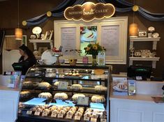 a bakery with cakes and pastries on display