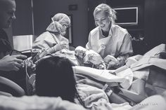 two women in hospital gowns are looking at a man who is laying in bed