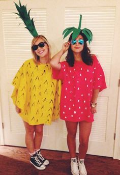 two girls wearing pineapple costumes standing next to each other