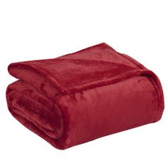 a red blanket is folded on top of a white background