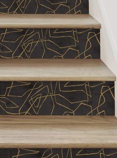 the stairs are painted with gold lines