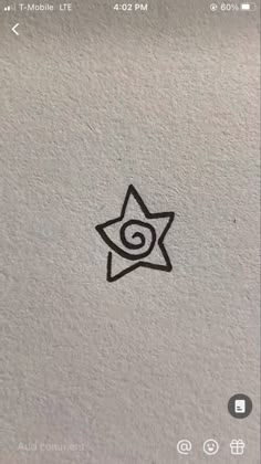 an image of a star with a spiral in the middle on a white background that appears to have been drawn