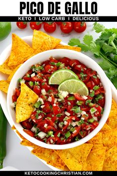 a white bowl filled with salsa surrounded by tortilla chips and cilantro