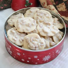 a tin filled with cookies sitting on top of a table