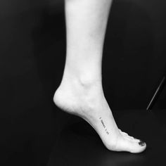 a person with a small tattoo on their foot