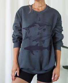 Whale Shark Shirt, Summer Sweatshirt, Coconut Girl Aesthetic, Environmental Shirt, Shirt for Summer, Summer Beach, Beach Bum Aesthetic, Summer Sweatshirt, Sweatshirt for Women, Women Trendy, Summer Shirt, Granola Girl  PRODUCT DETAILS & SIZING ✽ This cool sweatshirt is the perfect casual look for any woman. The soft material and trendy fit make it a comfy everyday essential. A great gift for yourself or someone you love! These garments are made from 50% polyester and 50% cotton. This combination helps designs come out looking fresh and beautiful. The collar is ribbed knit, so it retains its shape even after washing. There are no itchy side seams on these sweaters. ✽ Please order 1-2 sizes larger than your normal size if you are looking for an oversize look!  CARE AND INSTRUCTIONS ✽ Machine Shark Shirt Aesthetic, Whale Sweatshirt, Beach Bum Aesthetic, Grunge Sweatshirt, Shark Sweatshirt, Coconut Girl Aesthetic, Summer Sweatshirt, Trendy Fits, Shark Shirt