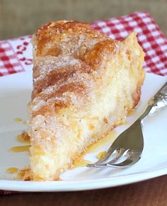 a slice of easy sopapilla cheesecake on a white plate