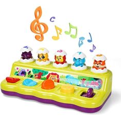 an electronic toy with musical notes coming out of it