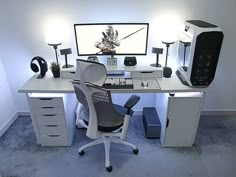 a computer desk with a monitor and keyboard