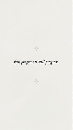 the words slow progress is still progress written in black ink