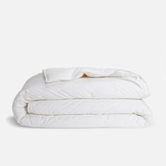 two white pillows stacked on top of each other