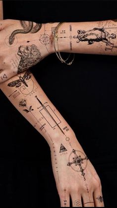 a woman's arm with tattoos on it