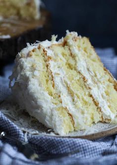 a close up of a slice of cake on a plate with a napkin and fork