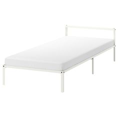 a white bed frame with no sheets on it