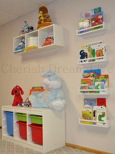 a child's room with bookshelves and toys