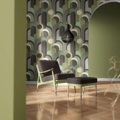 a chair and ottoman in front of a green wallpapered room with an arched doorway