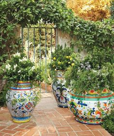 the front cover of garden chic magazine, featuring colorful pots with plants in them