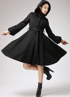 A wardrobe must-have , This Black wool coat features a Hood and Lantern Sleeve, Finished with a fit and flare style and a self-tie waist belt, This winter jacket pairs perfectly over your favorite fall dresses for added warmth.DETAIL* Wool blend fabric, and Polyester Lining* Long lantern sleeves * button fastening thro Black Wool Coat Women, Black Wool Coat, Wool Coat Women, Winter Outerwear, Belted Coat, Cashmere Coat, Lantern Sleeve, Hooded Coat, Chiffon Lace