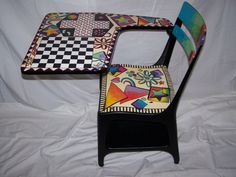 two chairs made to look like they are painted with different colors and designs on them