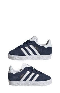 Initially designed in '91 as a training shoe for top athletes, the iconic Gazelle sneaker has been refreshed with stretchy laces for your little athlete. Pull-on style with elastic laces Removable insole Leather or leather and synthetic upper/textile lining/rubber sole Imported Adidas Kids, Elastic Laces, Training Shoes, Navy White, Navy And White, Rubber Sole, Nordstrom, Adidas, Elastic